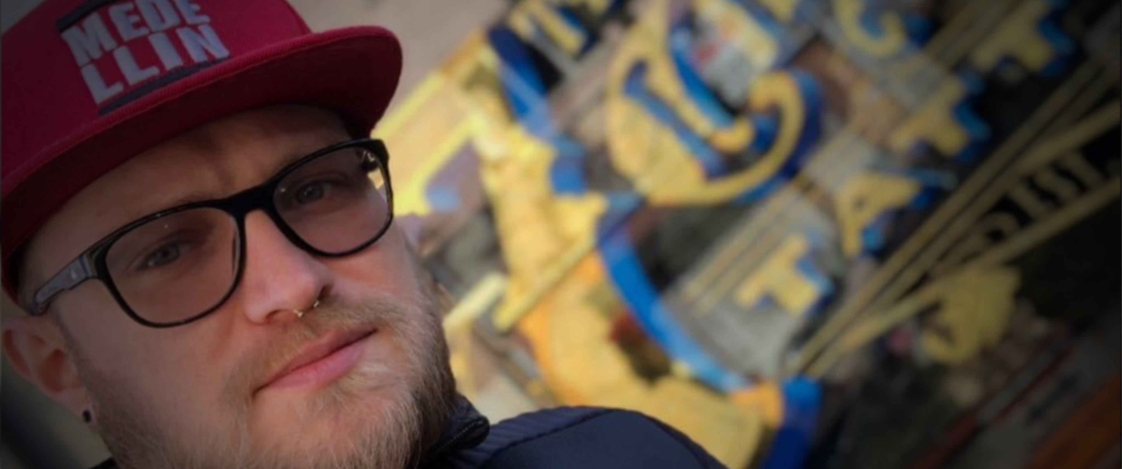 Bogdan Piwowarski stood in front of 7th circle tattoo & Piercing in Oldham