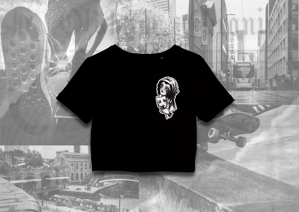 Front view of a 7th circle tattoo & piercing crop top